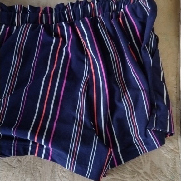 Blue short with white purple and neon orange stripes and a little white spaghett - Picture 3 of 4